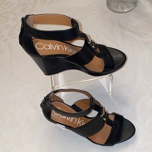 NWOT Black wedges brand new with gold accent in the front